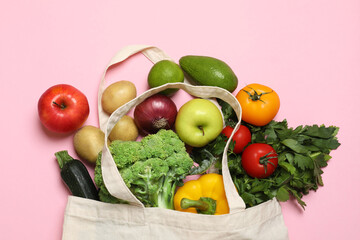 Poster - Delivery of vegetarian products. Bag with different vegetables and fruits on pink background, top view