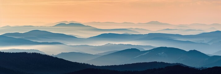 Poster - Mountain silhouettes and layers of mist illuminated by a stunning sunrise, creating a serene and expansive dawn landscape.