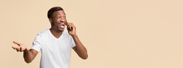 Aufkleber - Phone Call. Excited African American Man Talking On Cellphone Standing Over Yellow Background. Studio Shot