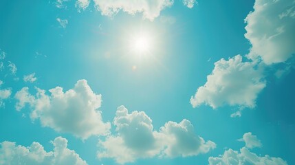Wall Mural - A sunny day with a clear blue sky and white clouds