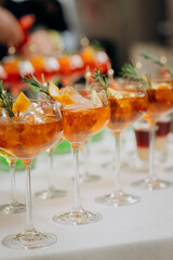 Welcome drink with cocktail glasses and drinks at an event. Alcoholic beverages at a wedding