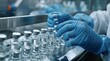 © AminaDesign - In a sterile lab, a skilled medical professional in gloves manages vaccine vials, highlighting the pharmaceutical assembly process that ensures safe and effective vaccinations for all patients