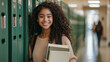 © forenna - A beautiful teenage girl with beautiful hair, casually leaning against green lockers in a school hallway, smiling at the camera while holding books and wearing a backpack. The imag