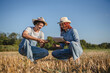 © Miljan Živković - woman and man farmers in the field check quality of the soil