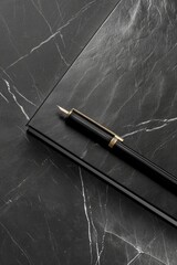 Poster - A pen resting on the cover of a black notebook