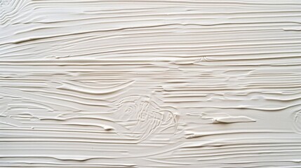 Poster - Close-up shot of a white painting on a wall, suitable for use in interior design or art-themed projects