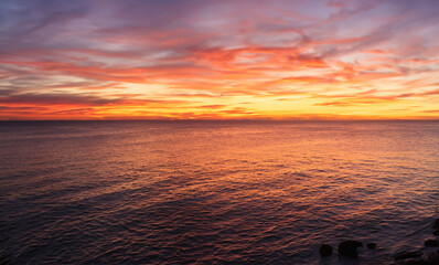 a beautiful sunset at sea on the island of Aruba generated with artificial intelligence