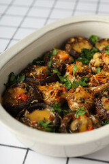 Wall Mural - Stuffed mushrooms in baking tray on light background, close up