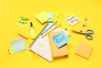 Wall Mural - Sticky notes with notebooks and stationery on yellow background