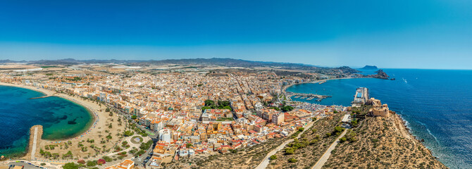 Wall Mural - Aerial view of San Juan fort and popular beach in Aguilas Spain, popular Mediterranean tourist destination with turquoise water