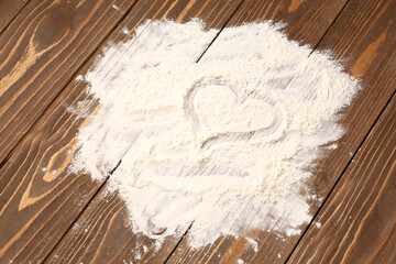 Canvas Print - Heart made of flour on brown wooden background