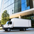 © Chanaka - A food delivery truck parked outside an office building.
