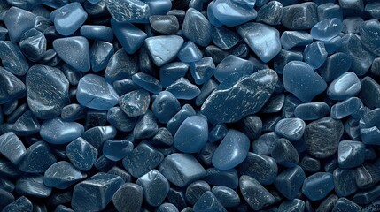   A stack of blue rocks atop another stack of blue rocks atop yet another stack of blue rocks