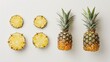 © Sinechana - 2. Detailed view of a fresh pineapple and its sliced pieces, set against a white background, emphasizing the freshness and tropical appeal
