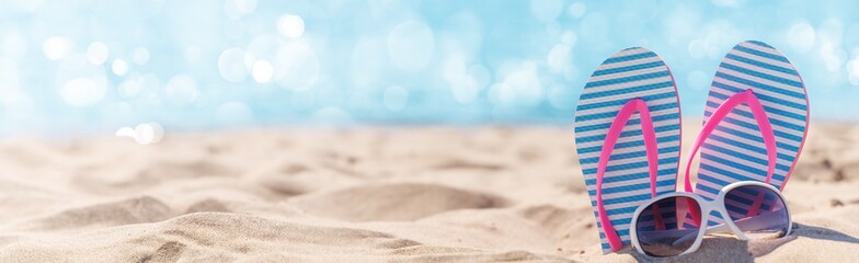 Poster - Flip flops and shades on the sea beach