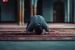 © Luxetify - A Muslim Man Kneeling in Prayer in a Mosque