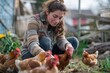 © cochisevisuals - Young woman tending to chickens in a backyard.