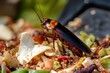 © Abdul - A cockroach exploring a pile of leftover food scraps in a garbage bin, with peeling vegetables and crumbs visible