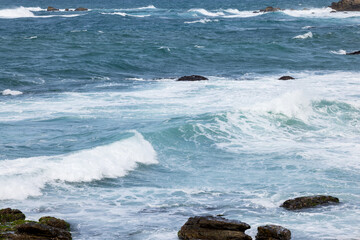 Wall Mural - Big sea wave splash over the shore