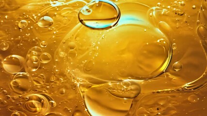Poster - Close up macro shot of golden liquid bubbles rising in a warm ambient light setting