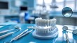 © Sunshine - Dental Tools and Model Teeth on a Blue Surface in a Modern Dental Clinic
