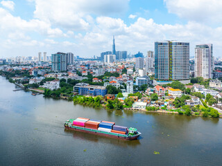 Wall Mural - Panoramic view of Saigon, Vietnam from above at Ho Chi Minh City's central business district. Cityscape with Landmark 81 skyscraper and many buildings, local houses, rivers.