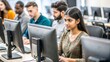 © N7 - An Indian woman working on a computer in a university computer lab, with other students and computer equipment visible.