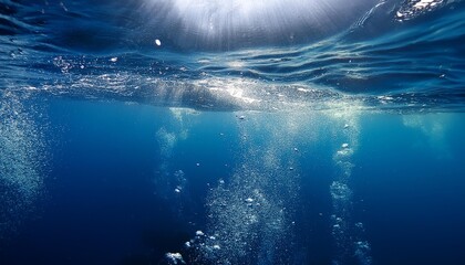 Underwater view with bubbles rising to the surface in a deep blue ocean. The image captures the serenity and mystery of the underwater world