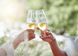 © KayJoint/peopleimages.com - Hands, couple and toast with champagne outdoor for anniversary, date celebration and bonding together. People, cheers and love with wine glass for romance, loyalty and commitment of relationship