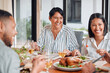© peopleimages.com - Family, happy and food for thanksgiving lunch with love, conversation and reunion for holiday tradition. Celebration, mature mom and daughter in home with feast together, laughing and bonding.