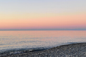 Wall Mural - tranquil nature background. pastel pink and blue color sea and sky