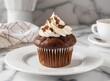 © D'Arcangelo Stock - Chocolate Muffin with Cream Isolated On Plate