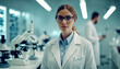 © Laslo - Beautiful young female scientist in white coat and glasses in a modern medical science lab