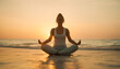 © Laslo - a young woman meditating on the beach