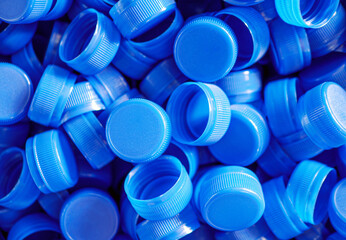 top view blue plastic bottle caps.recycling collection and production processing plastic bottle caps
