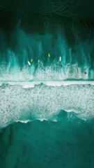 Wall Mural - An aerial view of surfers riding the waves at a beach, AI