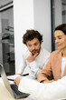 © Лиза Птицына - Professional management team in a meeting at the office. Leader discussing investment partnerships and digital project management with board members. Perfect shot to highlight effective teamwork and s