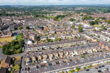 Aerial drone photo of the British town of Harrogate in North Yorkshire England which is east of the Yorkshire Dales in the summer time showing streets of residential housing estates from above