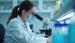 © vivekFx - Determination in the lab  A scientists focus under the microscope