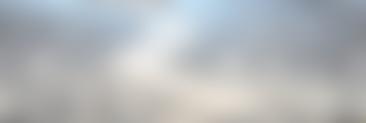 Poster - Soft clouds drift across a bright blue sky above a peaceful lake, reflecting the serene beauty of nature during midday