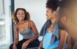 © peopleimages.com - Fitness, people and relax with talking in gym after exercise class, workout routine or cardio training with laughing. Group, break and happy team at sports club with conversation or health discussion
