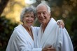 © ChaoticMind - A happy senior couple embracing in white robes, basking in nature's glow. Their expressions and the lush green backdrop blend to depict tranquility, warmth, and deep connection.