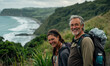 © IBEX.Media - Smiling middle-aged couple hiking on a scenic coastal trail with lush greenery and a view of the ocean in the background, enjoying outdoor adventure
