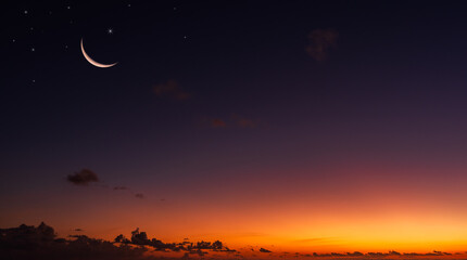Wall Mural - dusk sky with colorful sunset after sun down and crescent moon on dark blue hour twilight