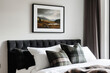 © gamespirit - A small framed art print on the wall above the bed, a modern bedroom with a Scottish landscape painting, black and white tartan-patterned pillows, sage green curtains, and a black headboard.