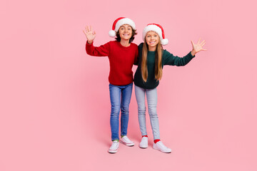 Sticker - Photo of two people kids wave hands celebrate christmas time isolated pastel color background