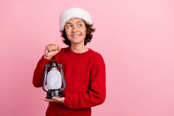 Poster - Photo of kid boy hold christmas lamp retro lantern look empty space isolated pastel color background