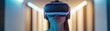 © Atthasit - Person wearing virtual reality headset in a minimalist room