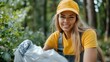 © Pinklife - Smiling woman wearing a yellow cap and work attire is cleaning up outdoors, showing dedication and environmental responsibility on a bright sunny day in a wooded area.