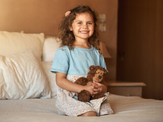 Girl, bear and child in portrait on bed with smile, relax and playful with toys in morning at family home. Kid, happy and plushy animal in bedroom for games, fantasy and excited at house in Australia